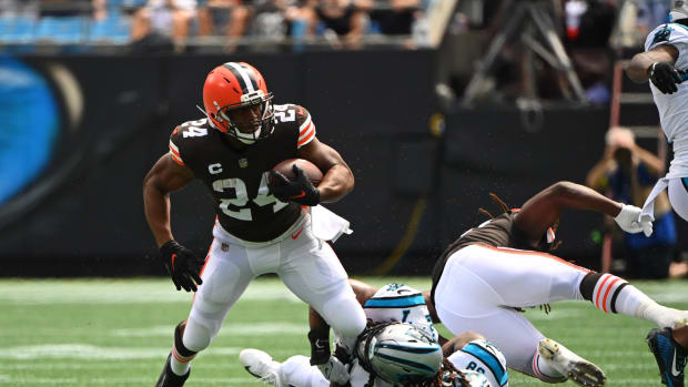 Sep 11, 2022; Charlotte, North Carolina, USA; Cleveland Browns running back Nick Chubb (24) is tackled by Carolina Panthers linebacker Shaq Thompson (7) and cornerback Myles Hartsfield (38) in the first quarter at Bank of America Stadium. Mandatory Credit: Bob Donnan-USA TODAY Sports